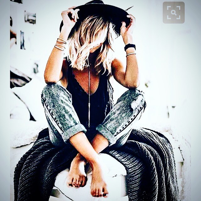 boho denim and hat on ottoman